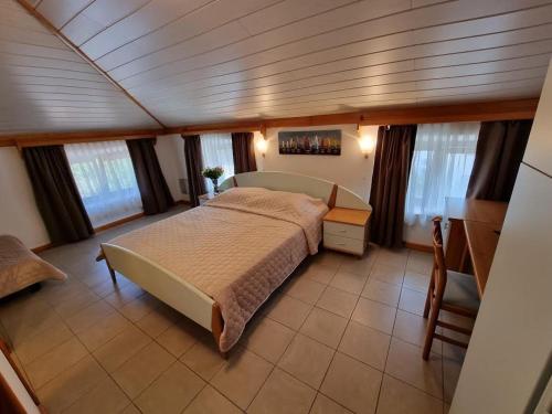 a bedroom in a boat with a large bed at Villa Riva in Omišalj