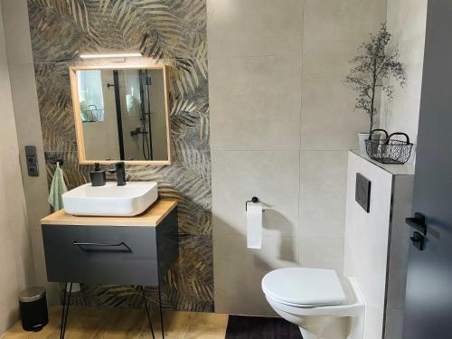 a bathroom with a sink and a toilet at M.F. in Znojmo