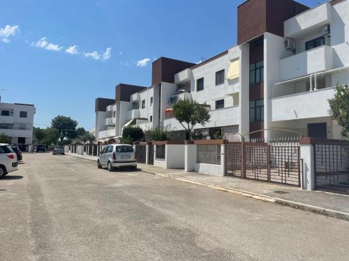 a car parked on a street next to a building at La terrazza sul MARE Manfredonia in Manfredonia