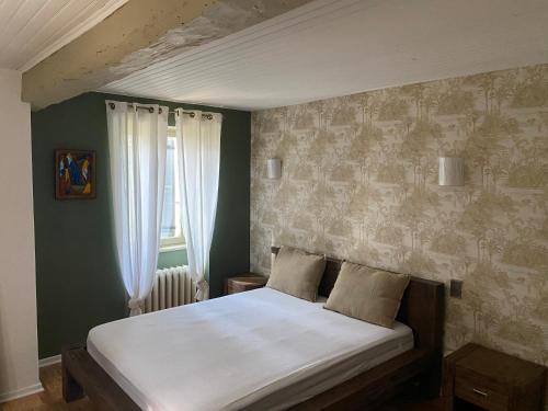 En eller flere senge i et værelse på Belle demeure en Gascogne