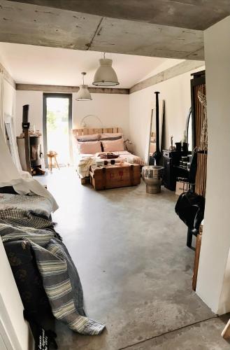 a room with two beds and a piano in it at NATURE HOUSE Pszczyna in Pszczyna
