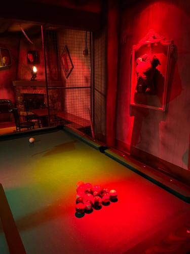a pool table with eight balls in a room at Insomnia Hotel in Berga