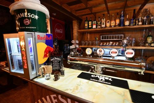 a bar with a bottle of alcohol on the counter at Penzión Šírava in Kaluža