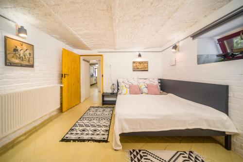 a bedroom with a large bed in a room at Ádám Apartman in Balatonföldvár