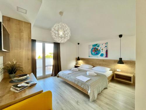 Postel nebo postele na pokoji v ubytování Apartments and Rooms Mateša