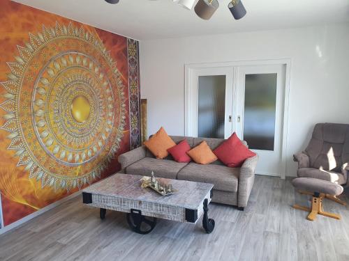a living room with a couch and a table at Fewo TaLuLa - Sauerland mit Hund in Medebach