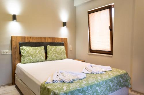 Postel nebo postele na pokoji v ubytování İznik Seyir Otel