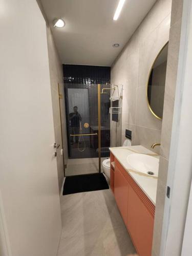 a bathroom with a shower and a toilet and a sink at cohen's house in Haifa