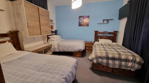 A bed or beds in a room at Ccapac Inka Ollanta