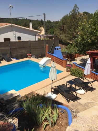 a large swimming pool with a slide in the background at La Buena Siesta in Ruidera
