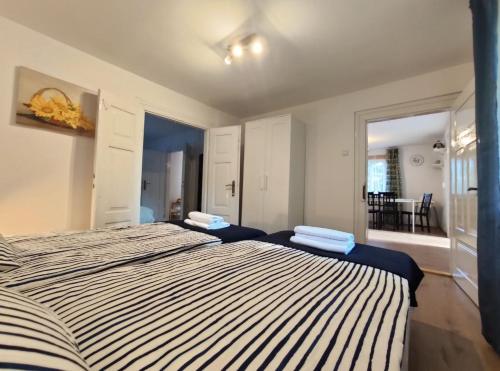 a bedroom with two beds with towels on them at Domek babci Marysi in Krasnobród