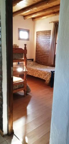 Ένα ή περισσότερα κρεβάτια σε δωμάτιο στο Cabañas Aike