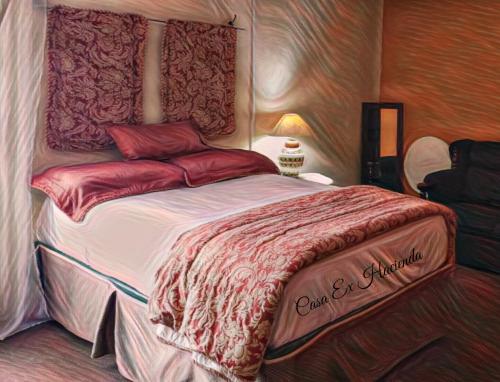 Ένα ή περισσότερα κρεβάτια σε δωμάτιο στο Ex Hacienda Hostal