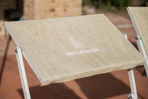 a wooden chair with the words melkbirk on it at Podere Mezzastrada - Place of Charme in Fiano