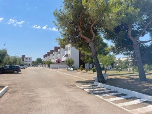 a street with trees on the side of a road at La terrazza sul MARE Manfredonia in Manfredonia