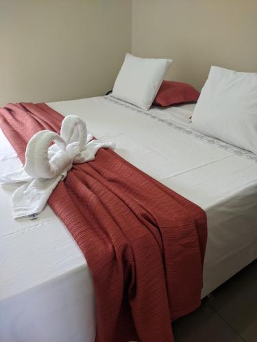 Katil atau katil-katil dalam bilik di Apartamento da Cintia