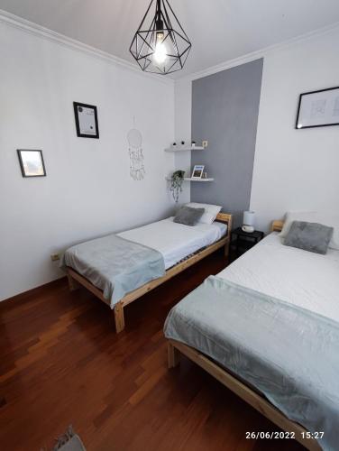 Postel nebo postele na pokoji v ubytování SINTRA HOME