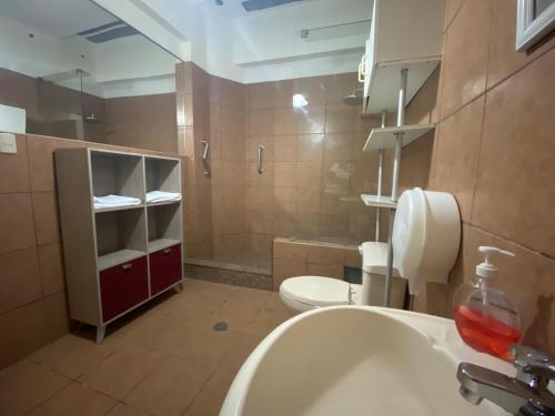 a bathroom with a sink and a toilet at Ica Adventures II in Ica