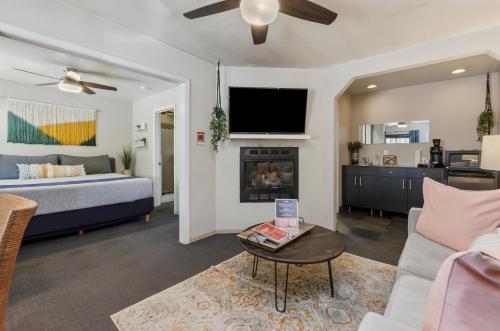 a living room with a bed and a fireplace at Playpark Lodge in South Lake Tahoe