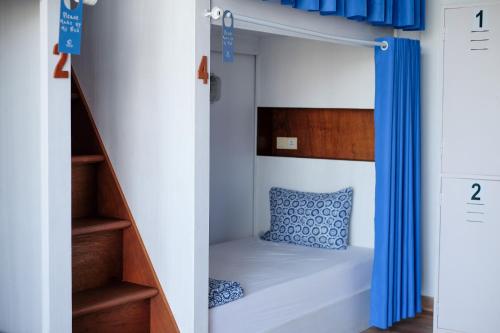 Voodi või voodid majutusasutuse Dip & Doze Boutique Hostel toas