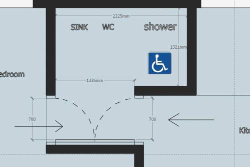 uma planta de piso de uma casa de banho com um chuveiro e uma placa de WC em The Dandelion Homestay em Baling