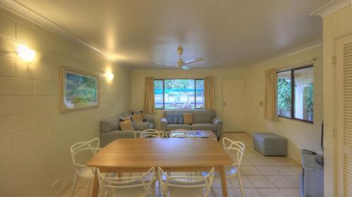 a living room with a table and a couch at Arcadia Palms 2 in Arcadia