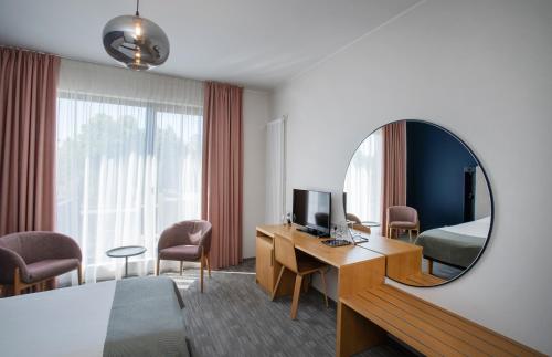 a living room filled with furniture and a window at Wasa Resort Hotel, Apartments & SPA in Pärnu