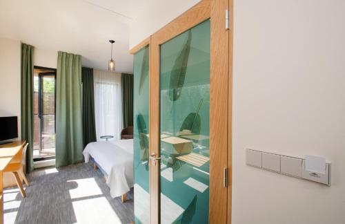 Una televisión o centro de entretenimiento en Wasa Resort Hotel, Apartments & SPA