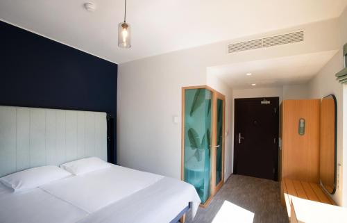 Cama o camas de una habitación en Wasa Resort Hotel, Apartments & SPA