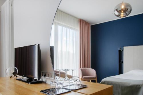 Una televisión o centro de entretenimiento en Wasa Resort Hotel, Apartments & SPA