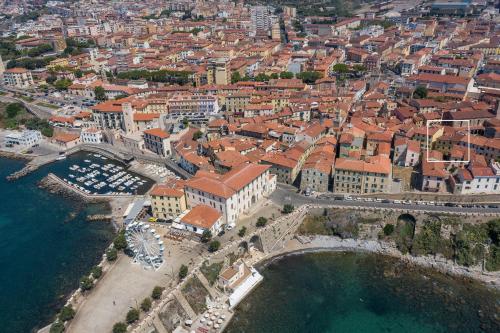 an aerial view of a city with a harbor at Casa del Pescatore in Piombino