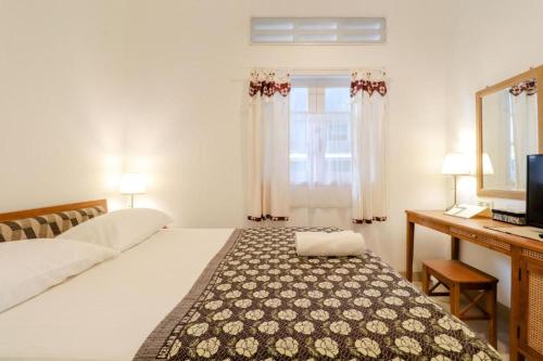 Postel nebo postele na pokoji v ubytování Palem Kipas Homestay