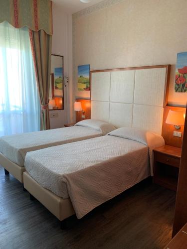 Postel nebo postele na pokoji v ubytování Hotel Apollo