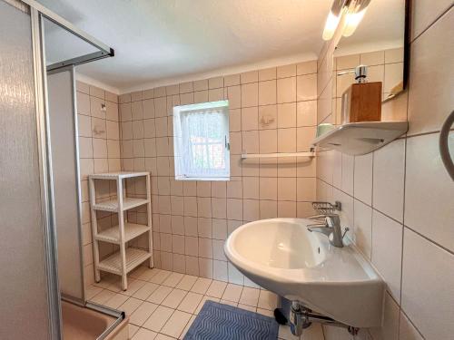 a bathroom with a sink and a shower at Holiday Home Wiegele by Interhome in Aich