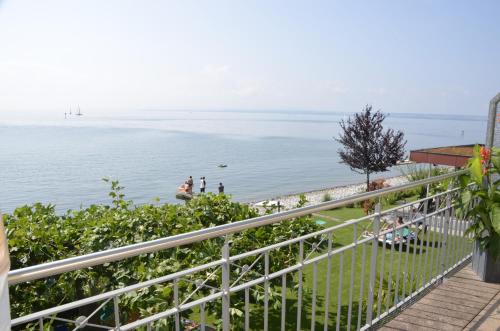 a view of the ocean from a balcony at Strandhaus Eberle in Immenstaad am Bodensee