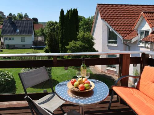 a bowl of fruit on a table on a balcony at Apartment Petra by Interhome in Nentershausen