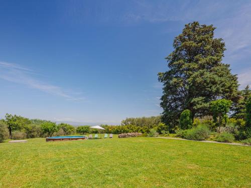 a park with a bench in the middle of a field at Apartment Rustico dei Canali by Interhome in Castelvecchio