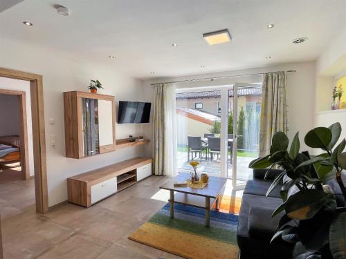 a living room with a couch and a table at Apartment Sonnseit Living by Interhome in Oberau