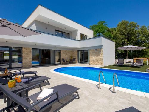 an image of a villa with a swimming pool at Villa Pinnidae by Interhome in Lopar