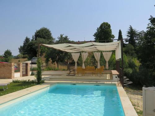 a swimming pool with a gazebo and a swimming pool at Holiday Home Tenuta Margherita by Interhome in Portacomaro