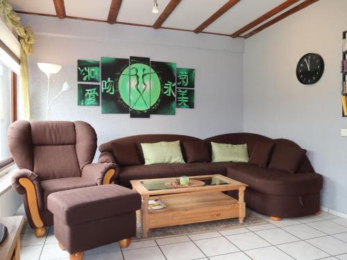 a living room with a couch and a coffee table at Holiday Home Ferienwohnpark Silbersee by Interhome in Frielendorf