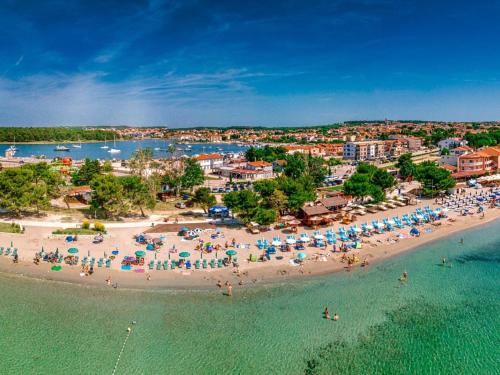 an aerial view of a beach with people and umbrellas at Apartment Hilde Blue-1 by Interhome in Medulin