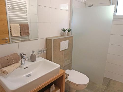 a bathroom with a sink and a toilet at Apartment Jonas by Interhome in See