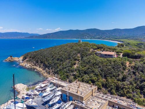 a group of boats docked on a small island at Villa Villa Giuliana by Interhome in Punta Ala