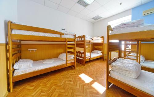 a group of bunk beds in a room at Traveler's haven in Odesa