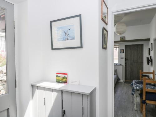 a room with white walls and a white counter at Little Crabapple in Swanage
