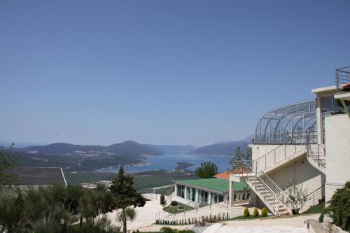 a building with a view of a lake at Villa Eagle Eye Montenegro in Kotor
