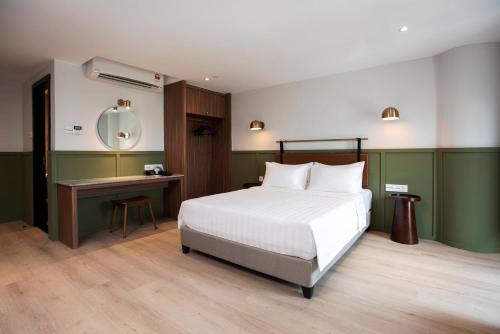 Ένα ή περισσότερα κρεβάτια σε δωμάτιο στο Monocolo Boutique Hotel