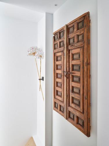an open wooden door in a room at LD Convento Cister in Málaga