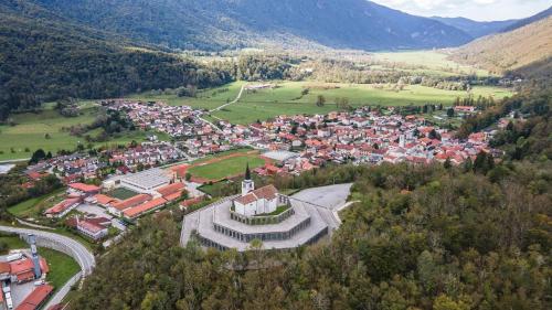an aerial view of a small town in the mountains at Apartment Aria in Kobarid
